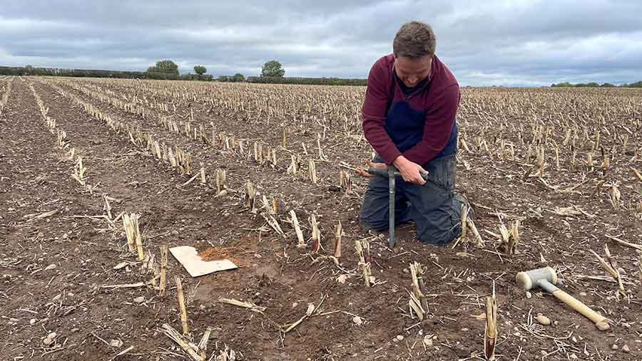 Man digging in arable field