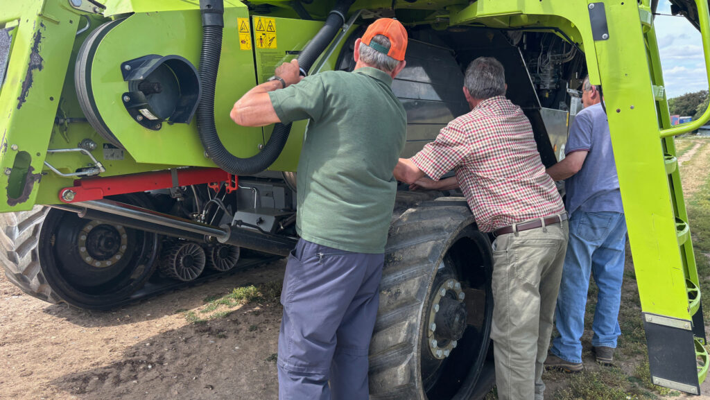 Three men and a vehicle