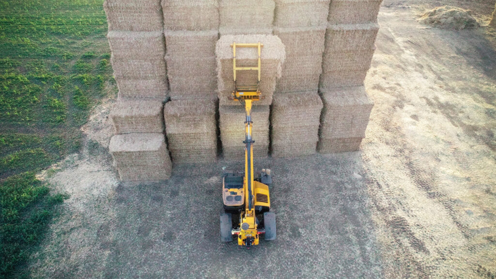 JCB Loadall stacking bales