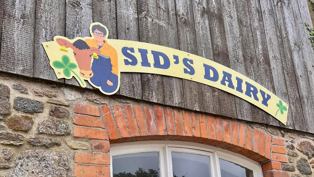 A sign for Sid's Dairy