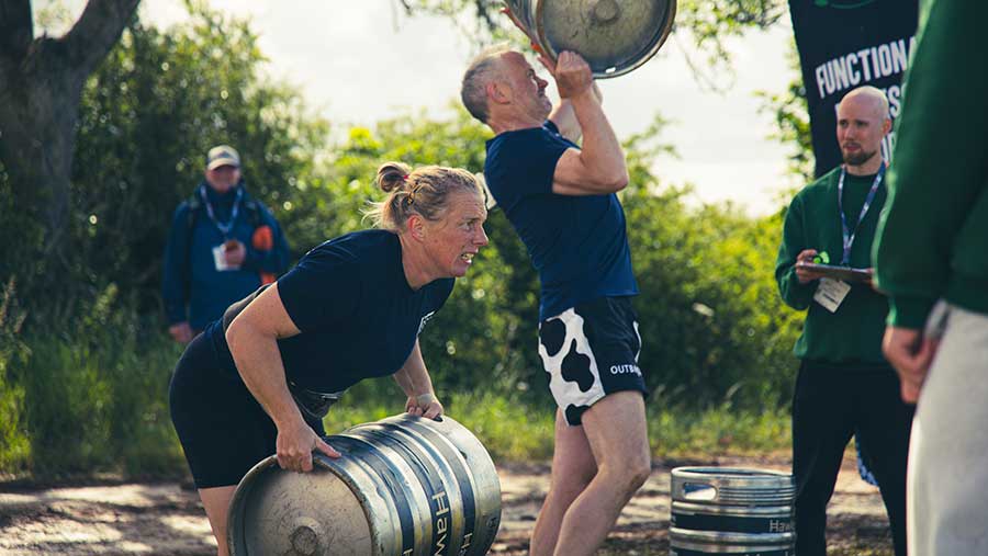 Farmer's carrying kegs