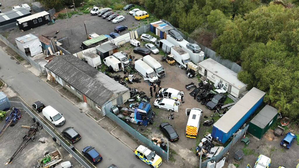 Aerial view of illegal 'chop shop' in rural location