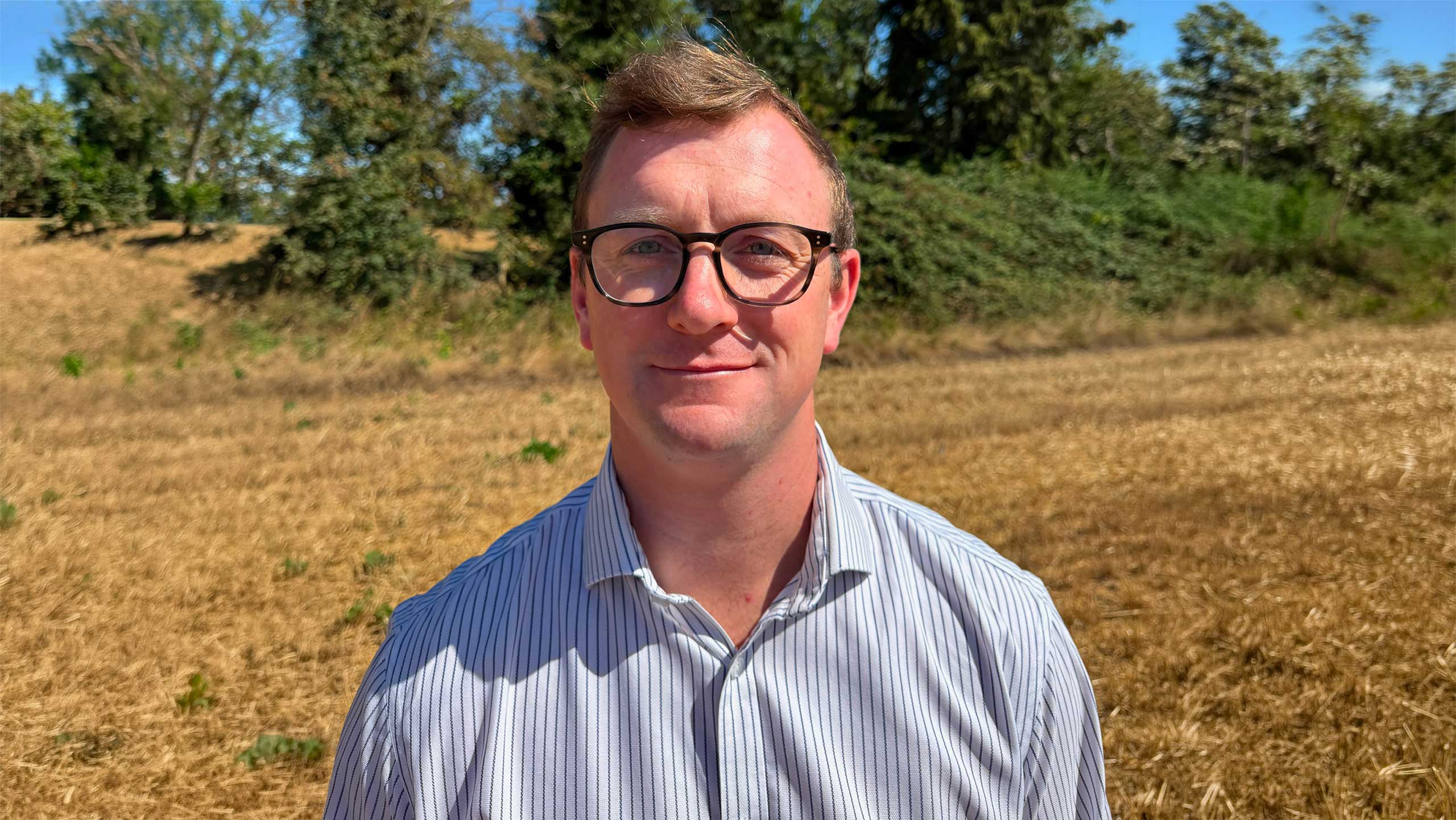 Andrew Cromie standing in field