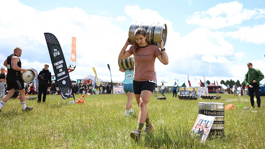 Woman carrying keg