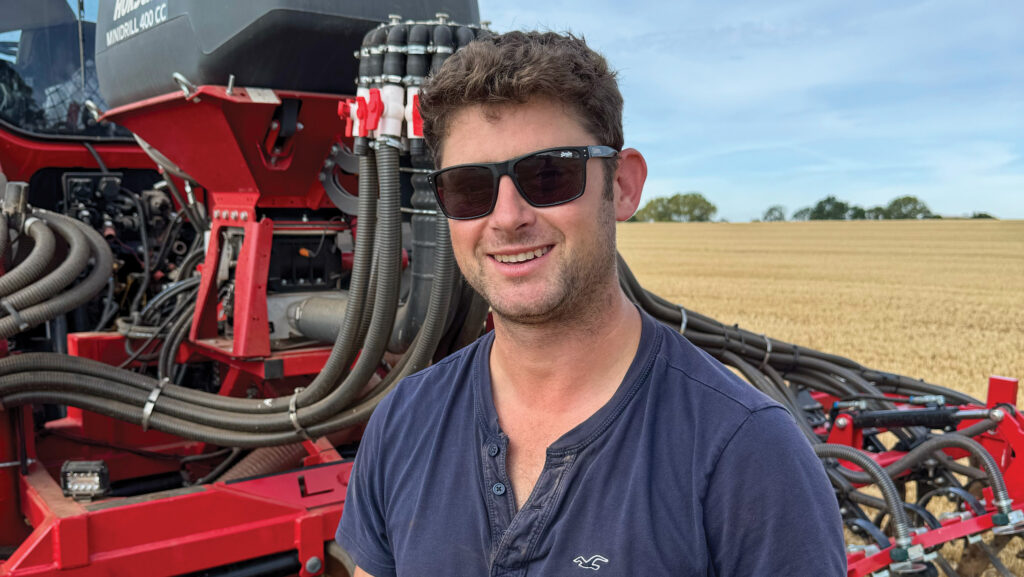 Lawrence Trivett  in field with drill