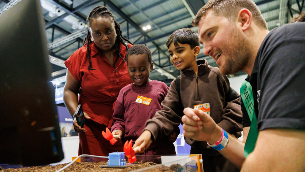 Schoolchildren learn about Harper Adams' involvement in the Earth Rover Program at New Scientist Live