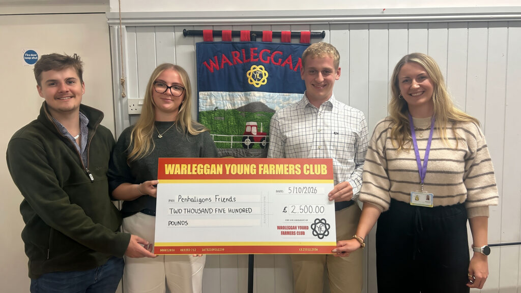 A large cheque held. by four people