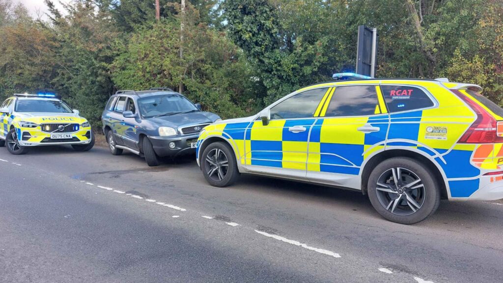 Cambridgeshire Police's Rural Crime Action Team and a suspect's vehicle © Cambridgeshire Police