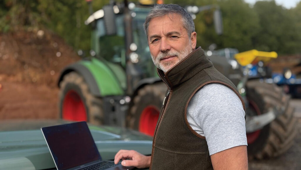 Clive Bailye with a laptop