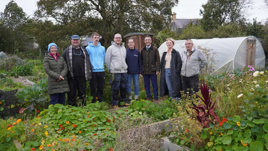 Daera minister Andrew Muir pictured with members of Quarries farm who were successful Social Farming applicants © Daera