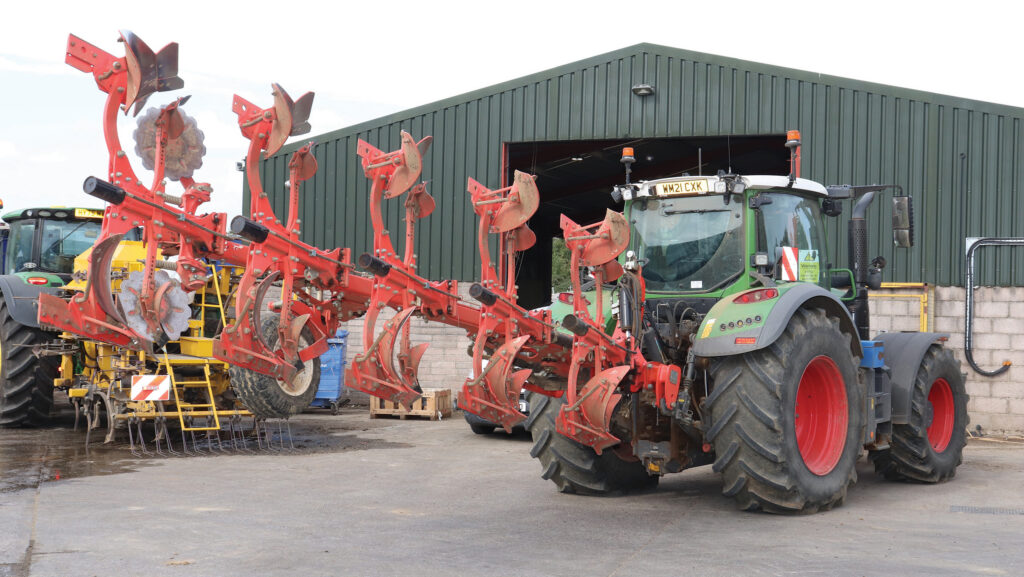 Green Fendt with red plough