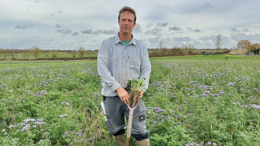 Stuart Tabenor standing in field