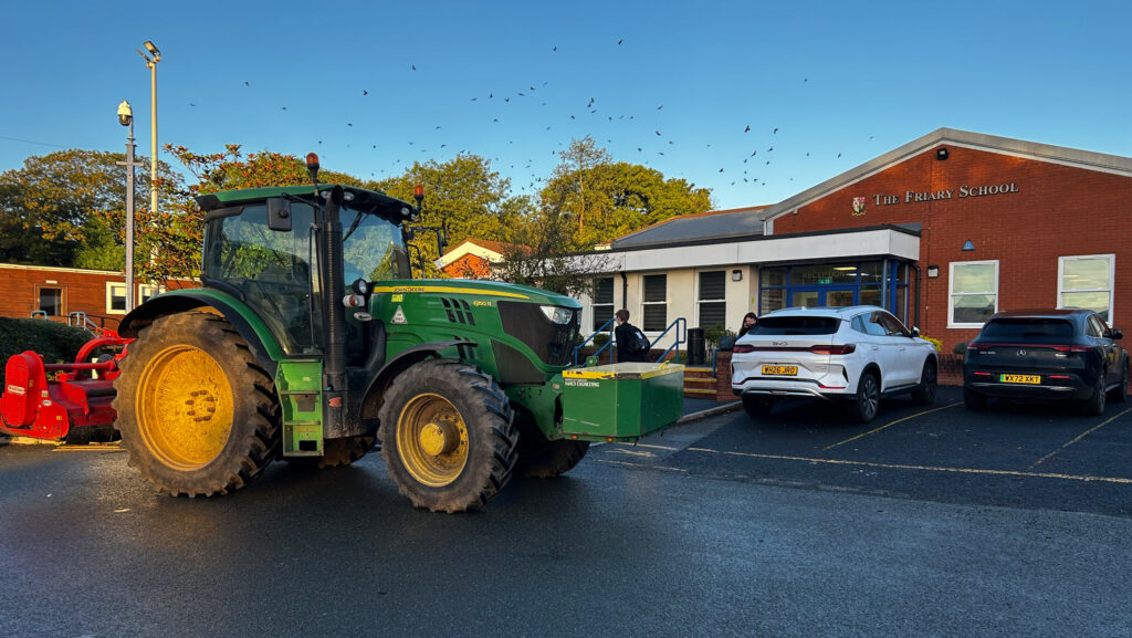 A John Deere tractor in the school car park