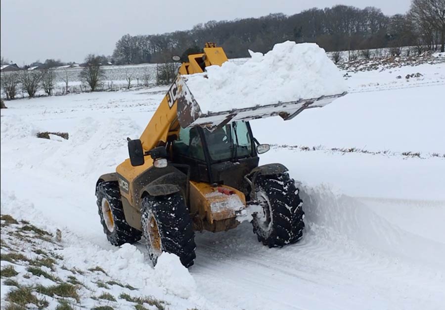 JCB clearing snow