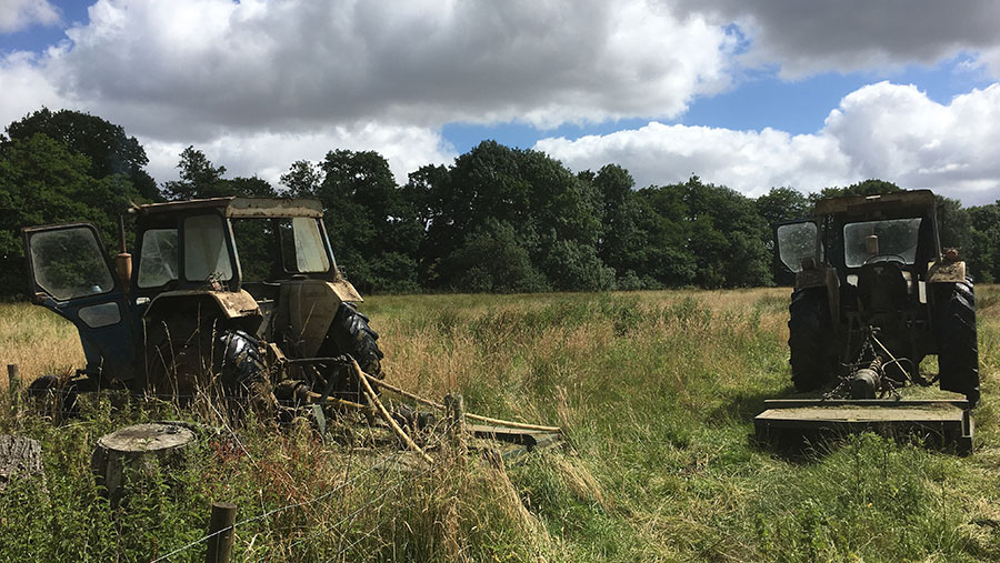 Tractors stand in a field