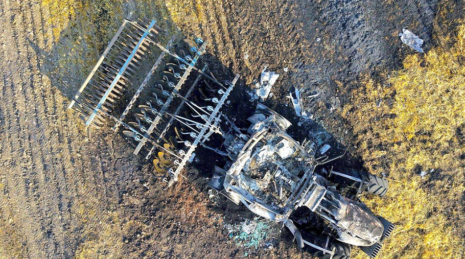 An aerial view of a burned out tractor