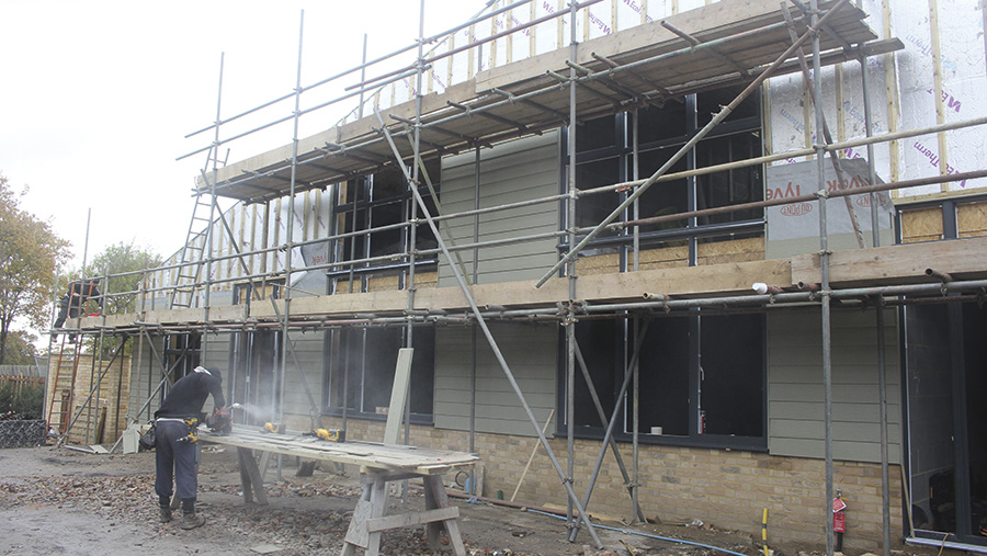 Construction work being undertaken on one of the farm barns