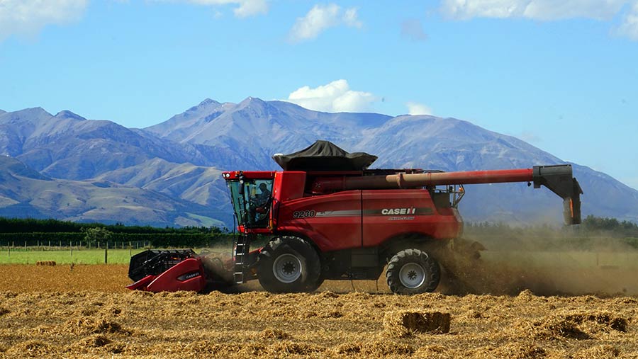 David Clark combining garden peas on the first day of harvest 2017 with Mount Hutt in the background © David Clark