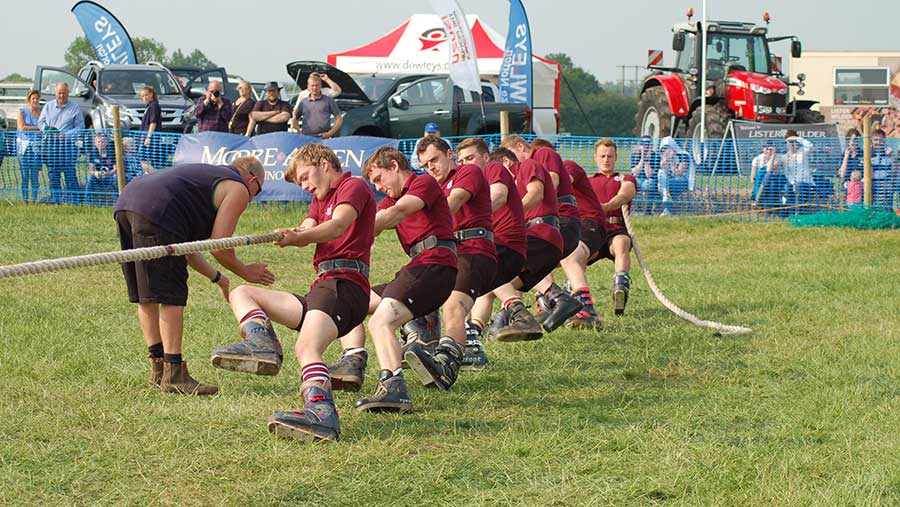 Members doing tug o war