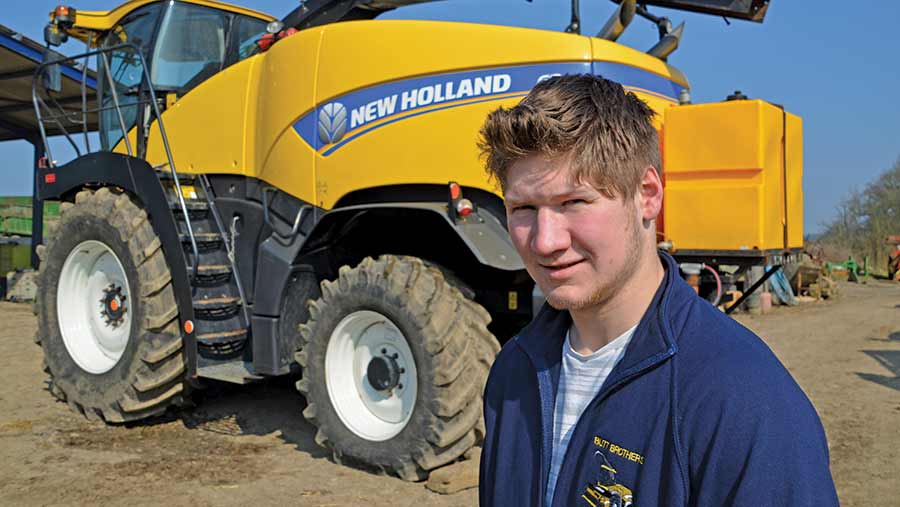 Andrew Butt in front of his New Holland forager