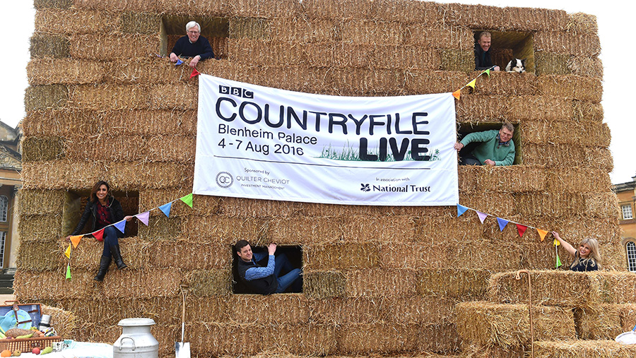 BBC Countryfile presenters pose in a sixteen foot haystack at Blenheim Palace to promote BBC Countryfile Live 