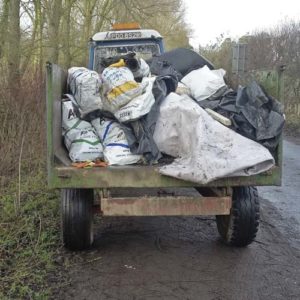 Fly-tipped waste is cleared up