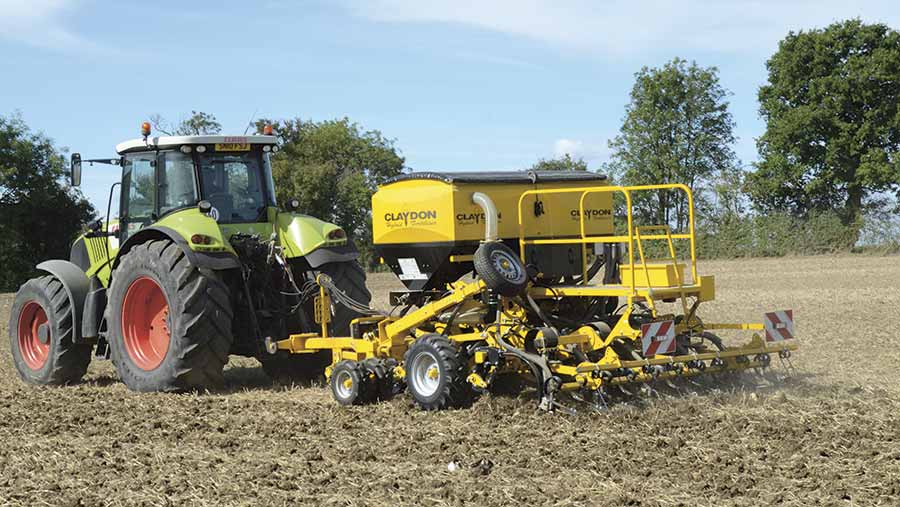 A tractor pulling a claydon hybrid drill