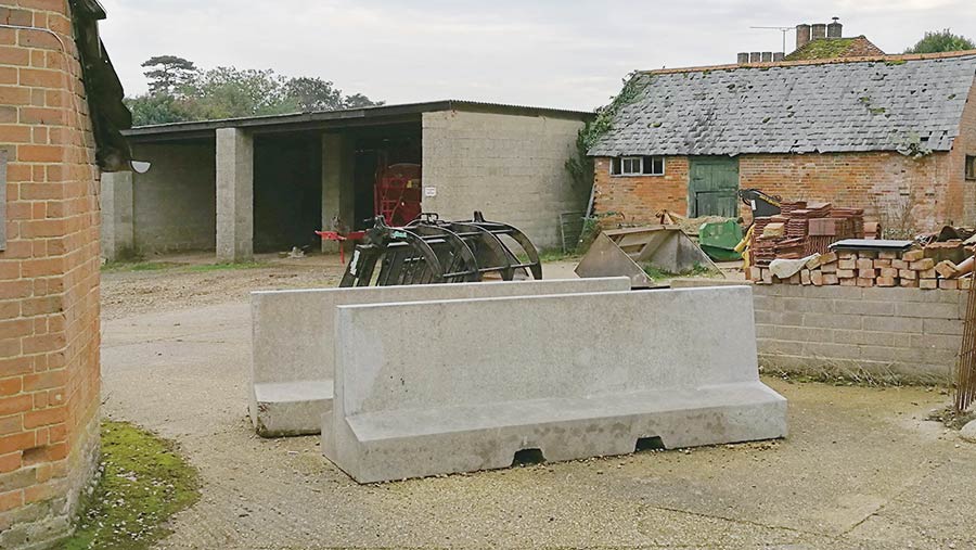 Concrete barriers around farm buildings