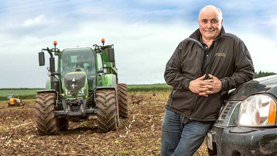 Russell Price in a field with a tractor