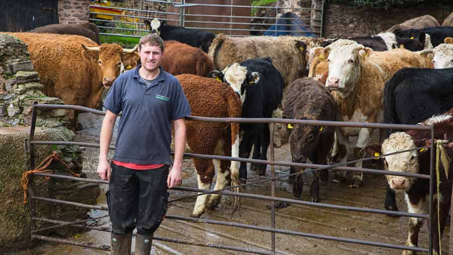 Dave Knight standing in front of his cow shed