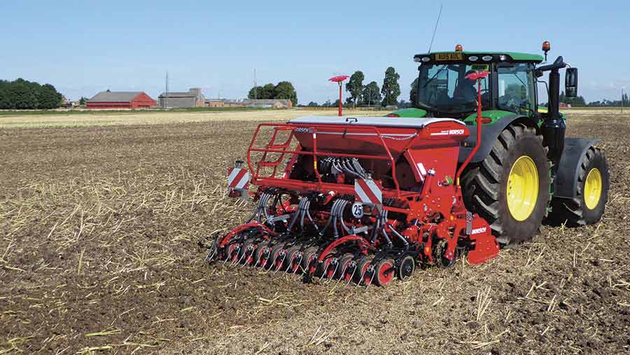 A tractor pulling a Horsch drill