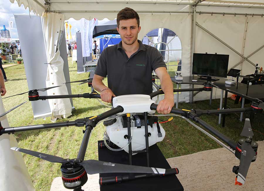 Hugh Wrangham with the sprayer drone © Tim Scrivener