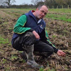 James Winslade crouches in a field