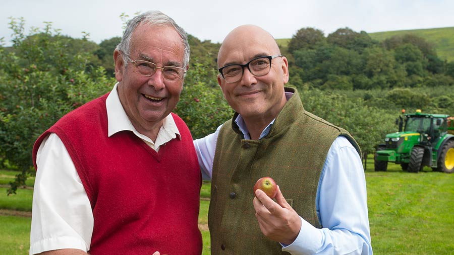 John Thatcher stands next to Gregg Wallace who is clutching an apple