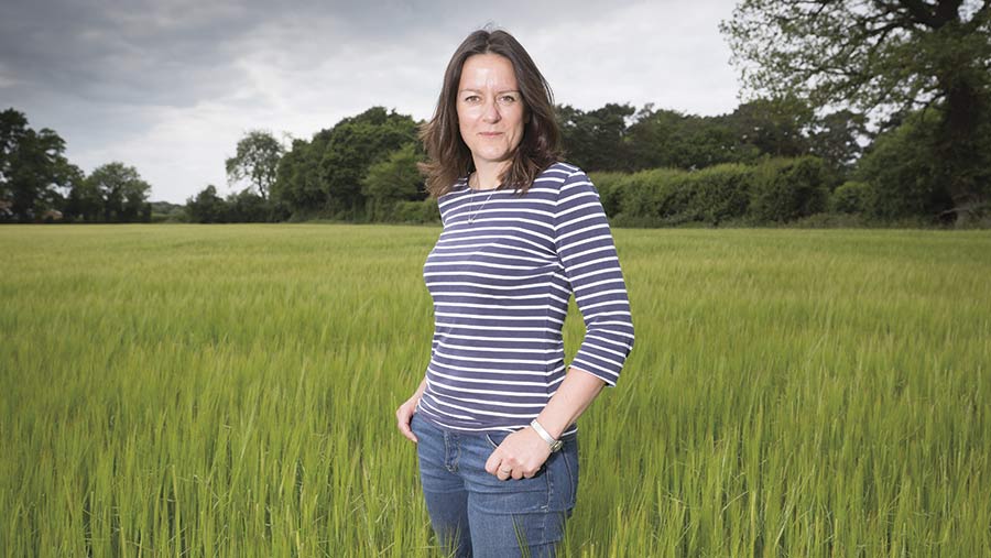 Emily Norton standing in a field