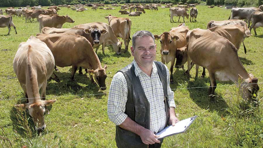 Paul Redmore in a field with cows