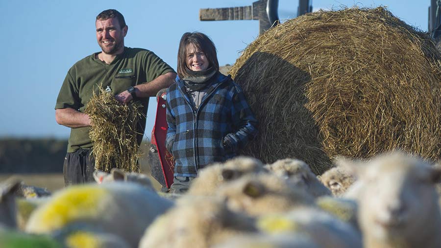 Farmers Matt and Pip Smith with some of their flock