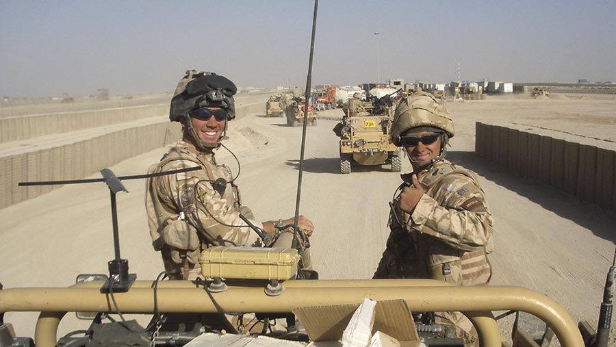 Jonathan Kerr on a military vehicle