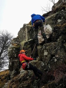 Rescuers abseiling down cligg