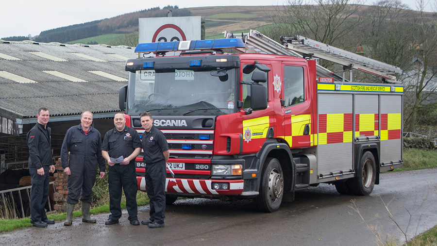 Lanarkshire farmer Tom French (second left) pictured with fire safety officers from Scottish Fire and Rescue Service, after completing his rural risk survey 