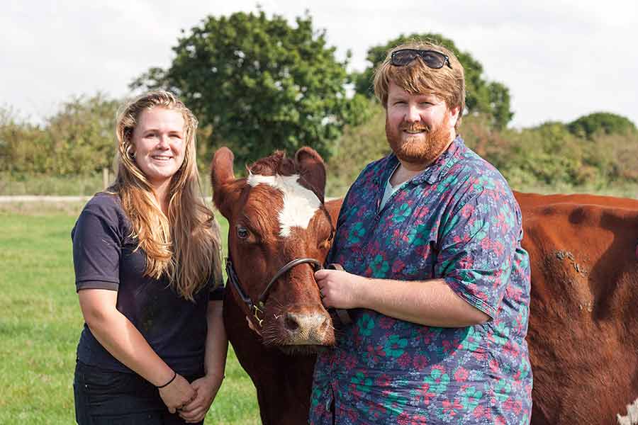 Farm manager Dan Stamper and former-student and herd manager Amy Alywin