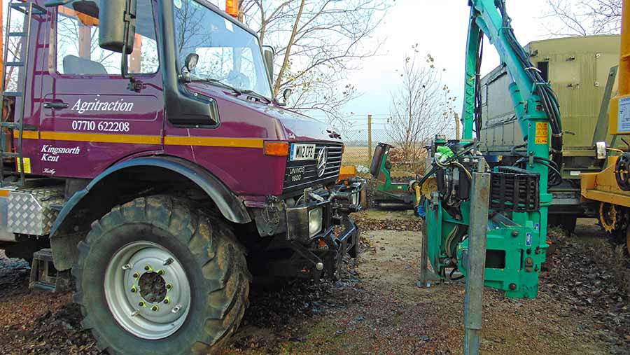 Showing how the Mulag hedge cutter fits on to the front of the Unimog