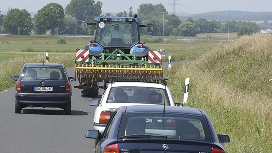 Cars behind tractor © image BROKER/REX/Shutterstock