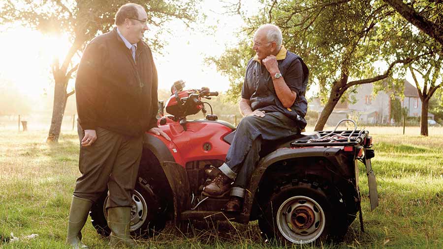 Farmer and worker on quad bike