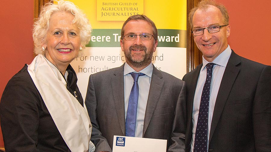 Mike Abram receives his prize from Yara's Rosie Carne and Mark Tucker © Ruth Downing/Rural Pictures