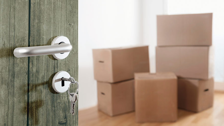 Key in a door, and boxes in the hallway