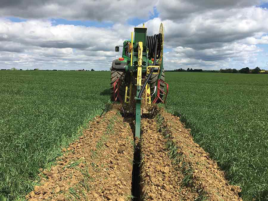 Digging a ditch with the trencher