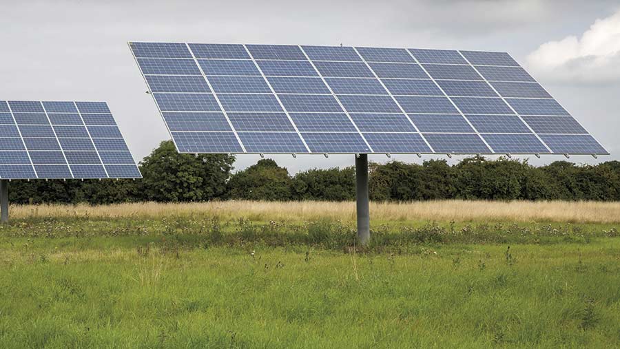 Ground-mounted solar panel in field