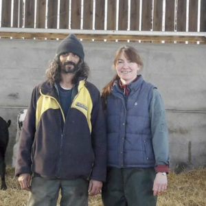 Steve and Jo Pile stand in a livestock shed