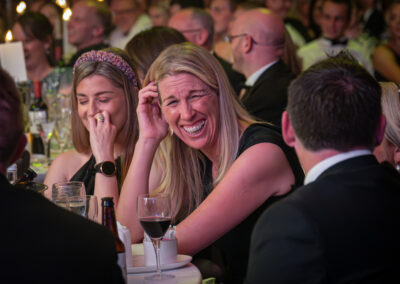 Guest at the Farmers Weekly Awards laughing in the audience